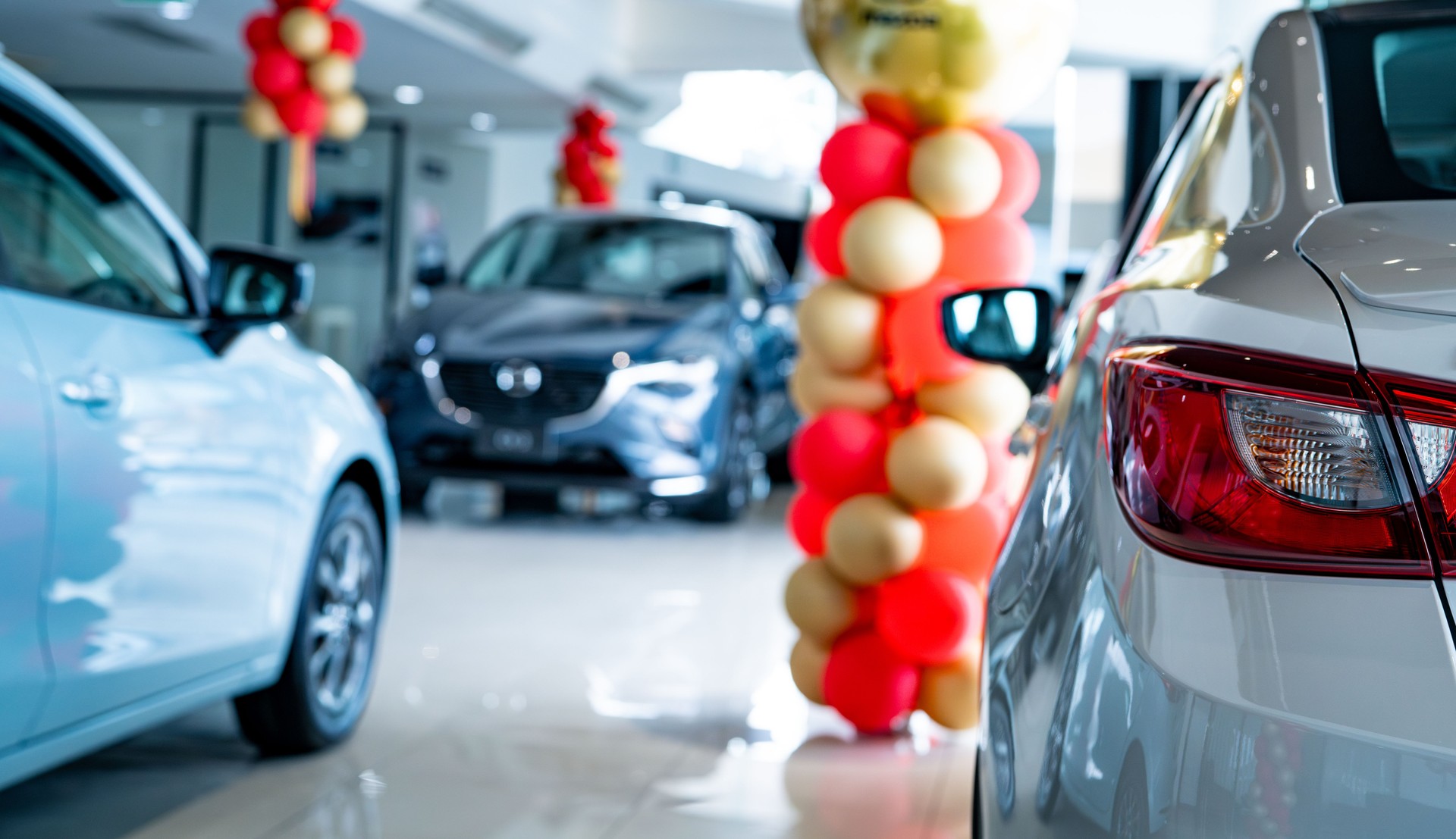 Selective focus new car parked in luxury showroom. Car dealership office. New car parked in modern showroom. Car for sale and rent business concept. Automobile leasing and insurance background.